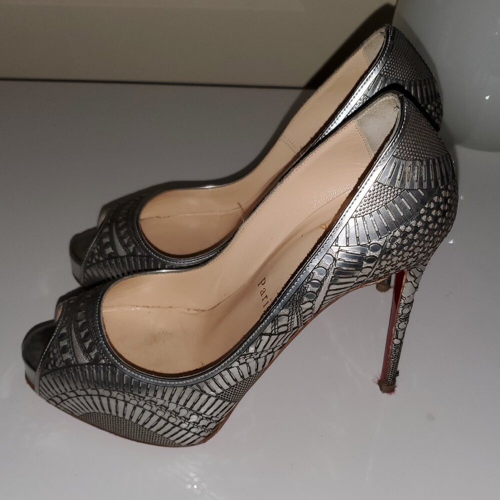 Stunning Christian Louboutin Silver Metallic shoes.
